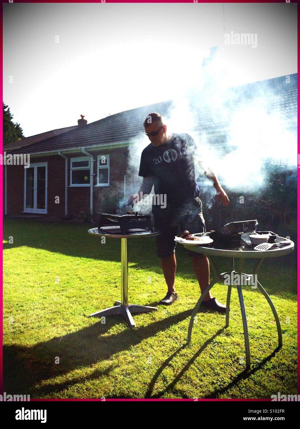 BBQ Man On Fire Foto Stock
