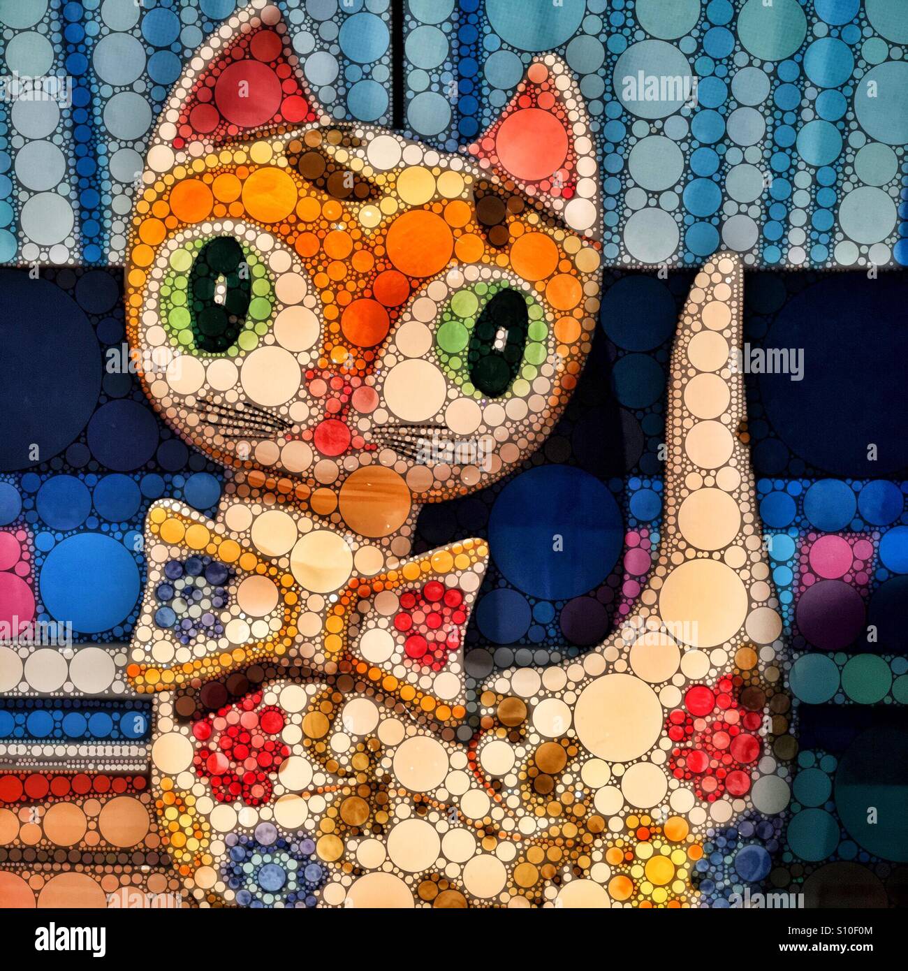 Una illustrazione digitale di un gatto che indossa un bow tie composta da centinaia di punti colorati. - Immagine stock catturata con smartphone