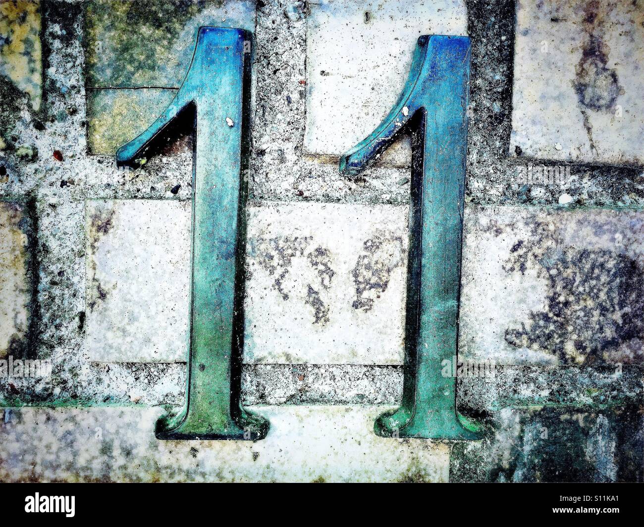 Numero 11 in metallo scritte Foto Stock
