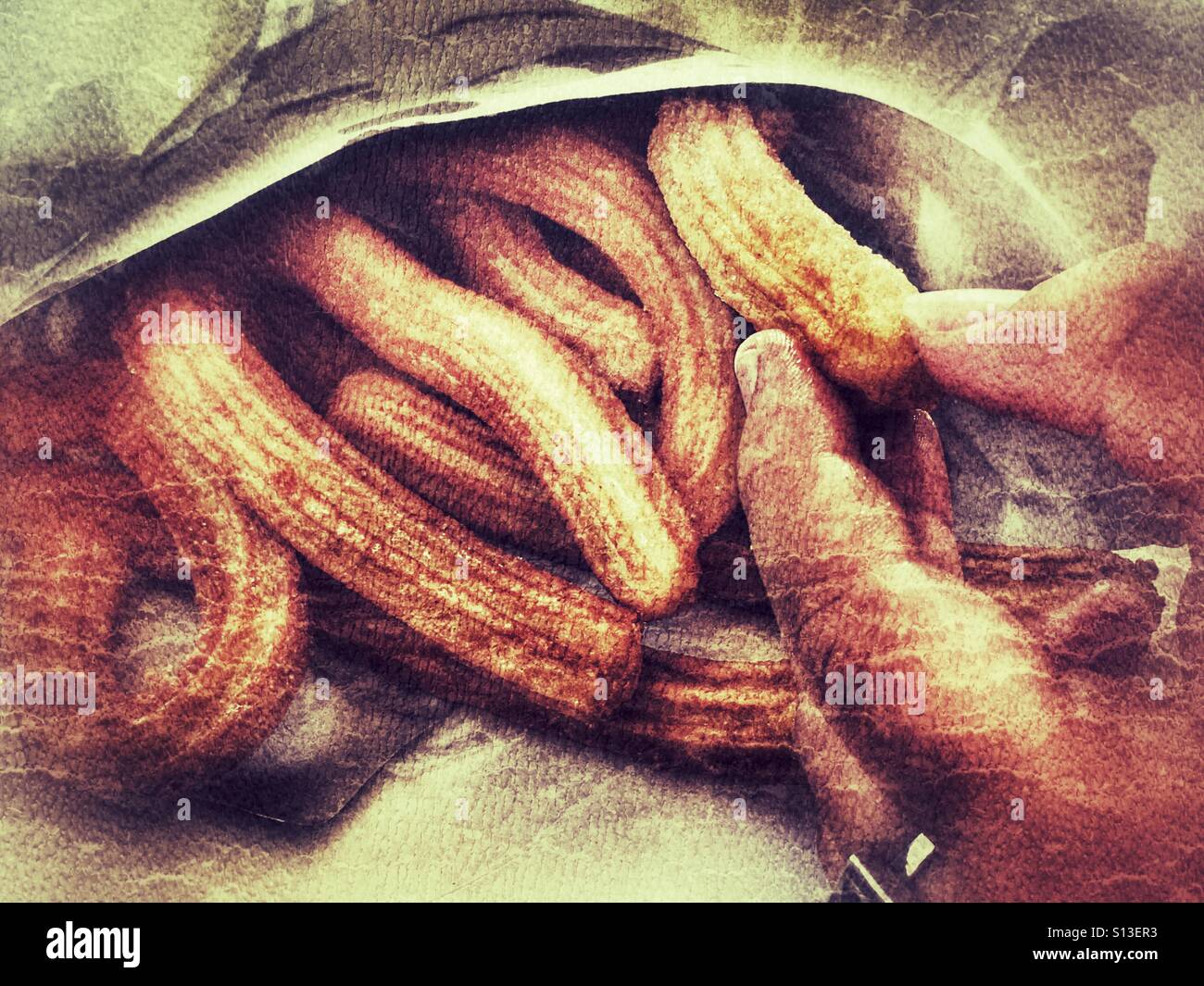 Churros. Tradizionale rivestite di zucchero impasto fritto pasticceria, un popolare snack in Spagna Foto Stock