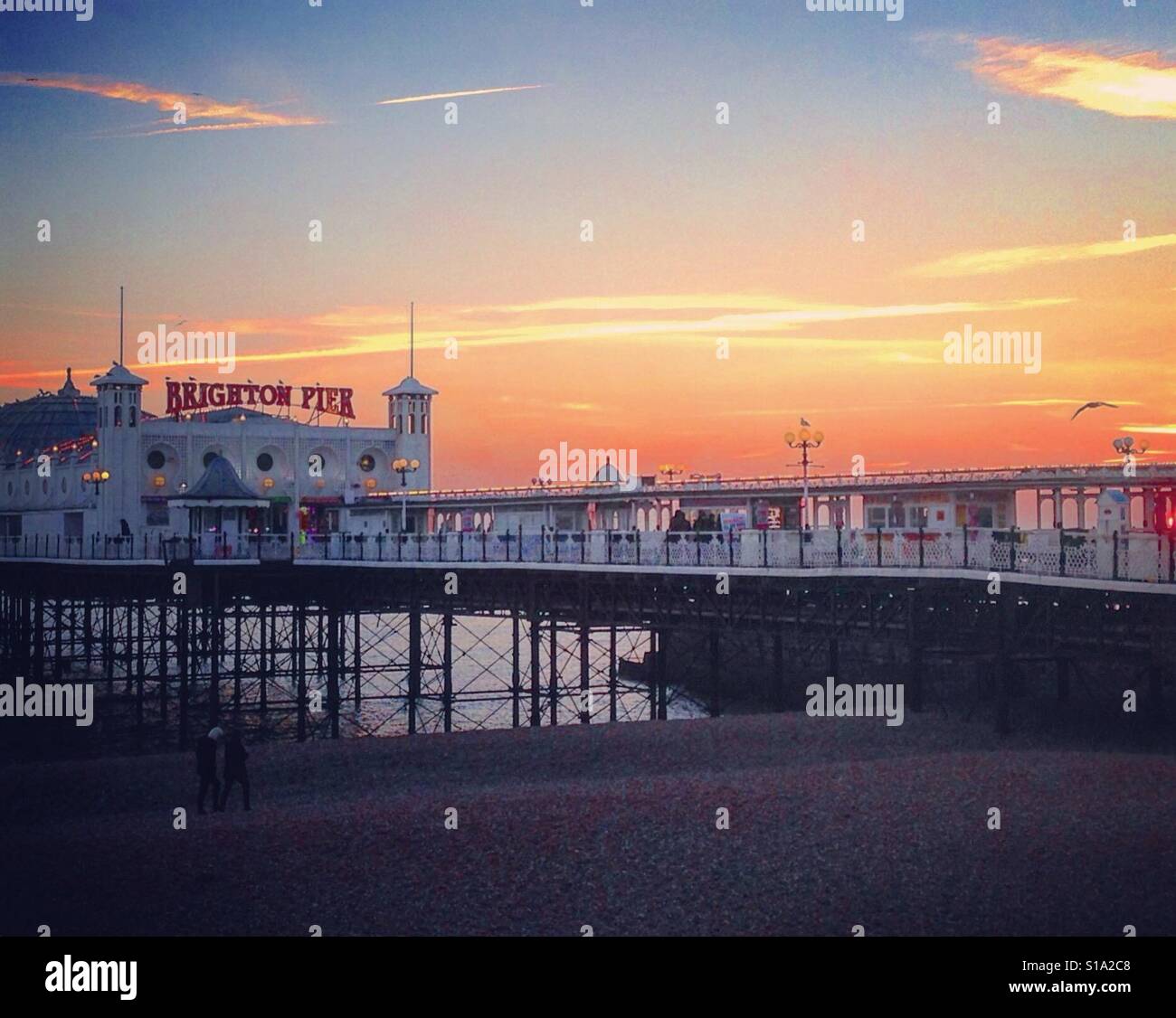 Brighton il tramonto dal Molo Foto Stock