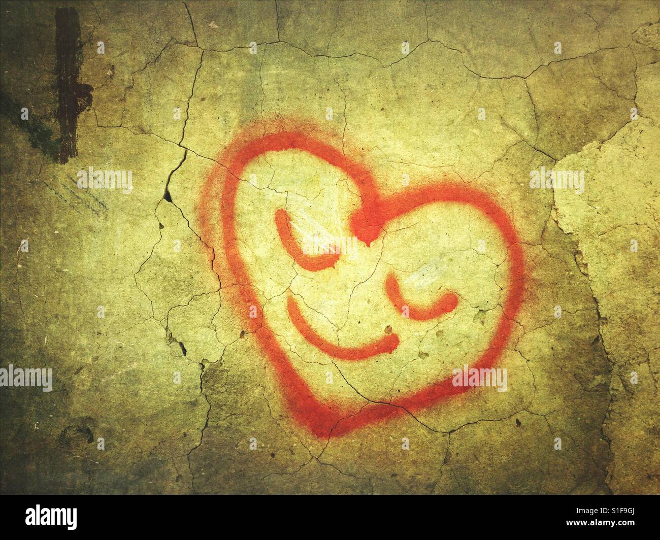 A forma di cuore ad Smiley face graffiti Foto Stock