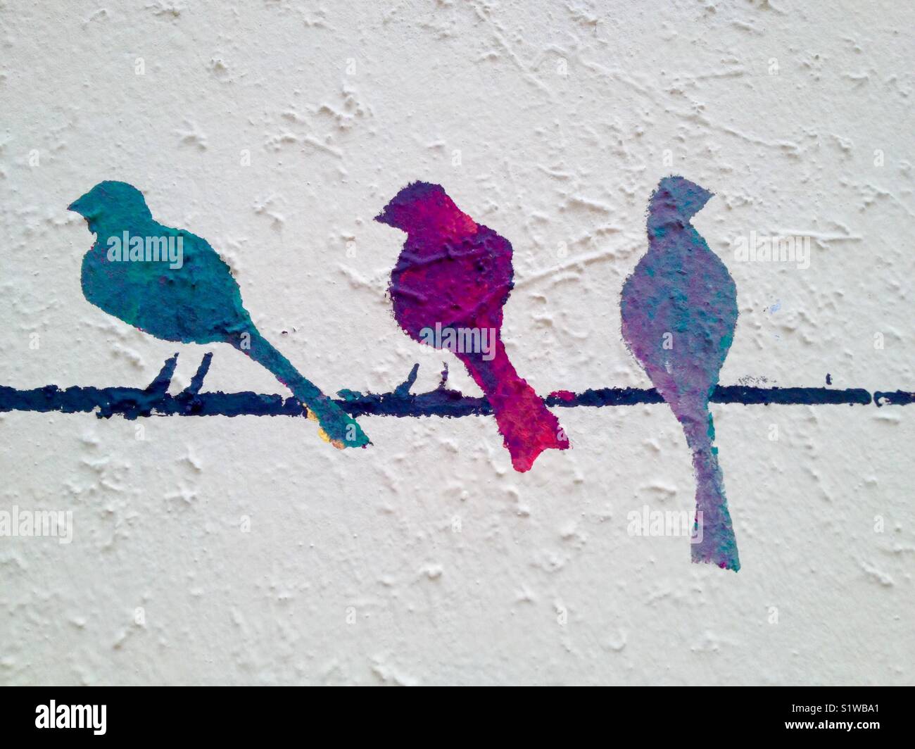 Gli uccelli dipinta su una parete Foto Stock