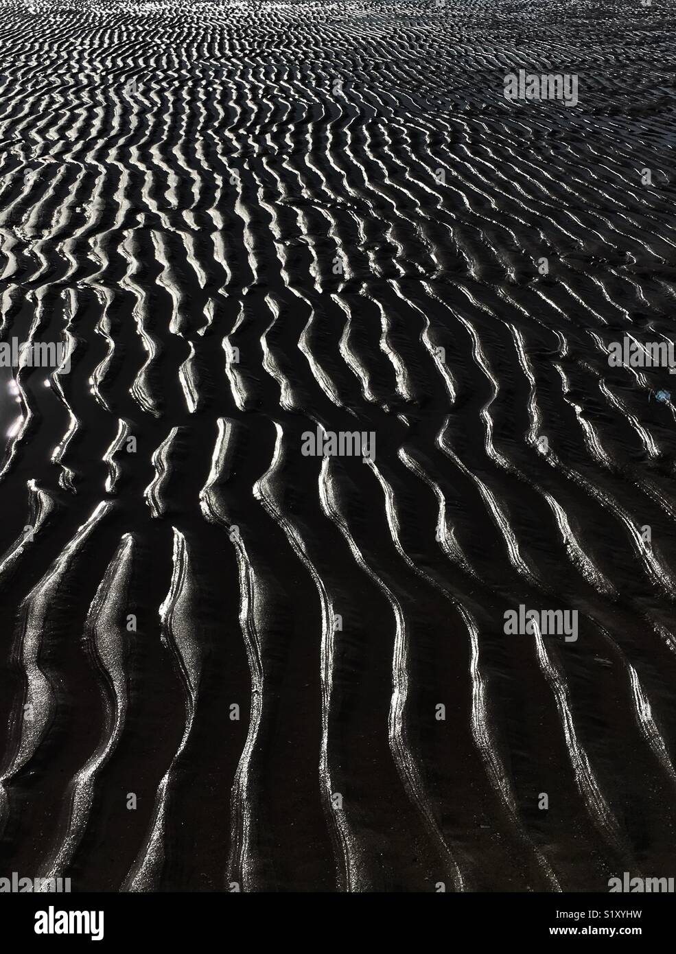Immagine grafica di ondulazioni in sabbia sulla spiaggia Foto Stock