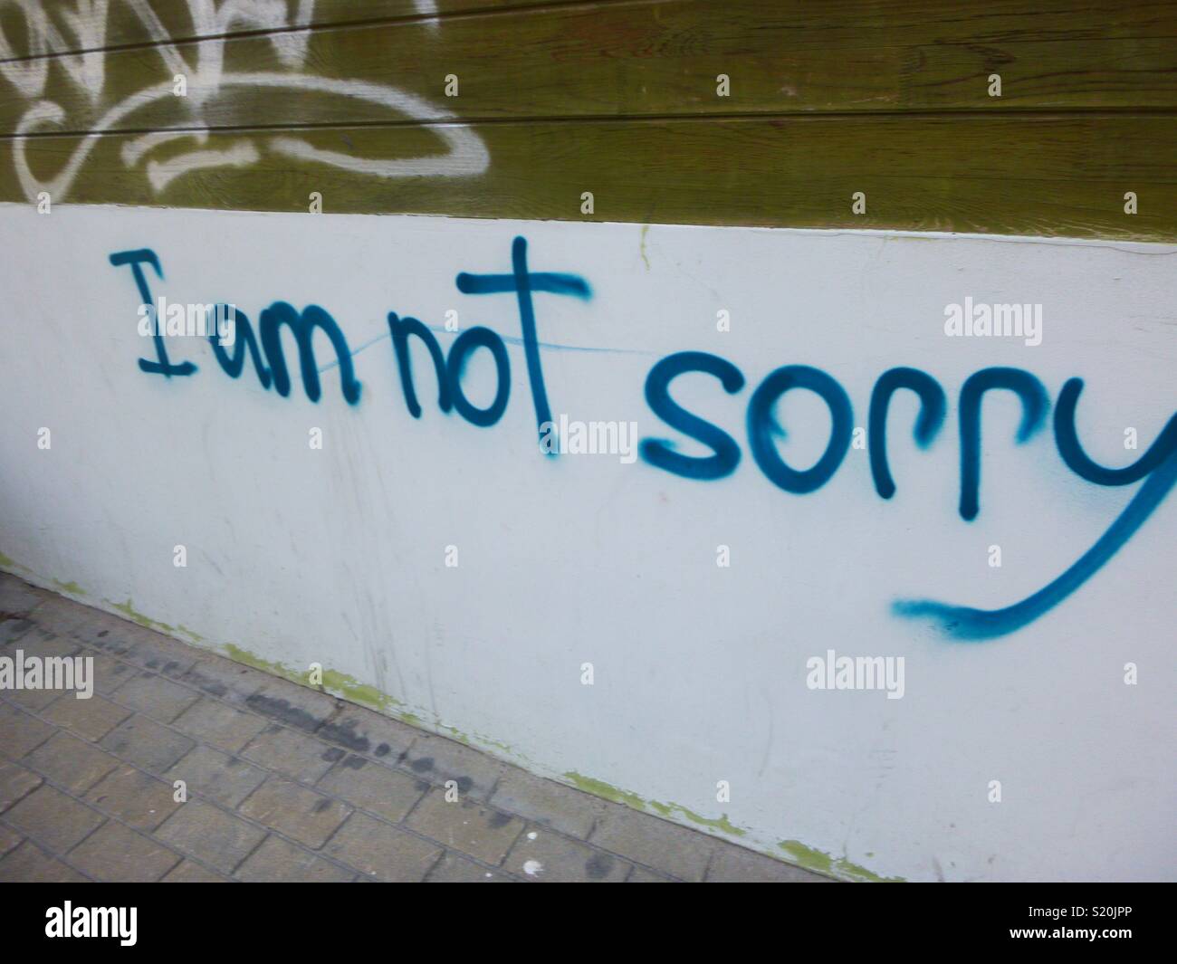 Non mi dispiace graffiti sul muro di Riga, Lettonia Foto Stock