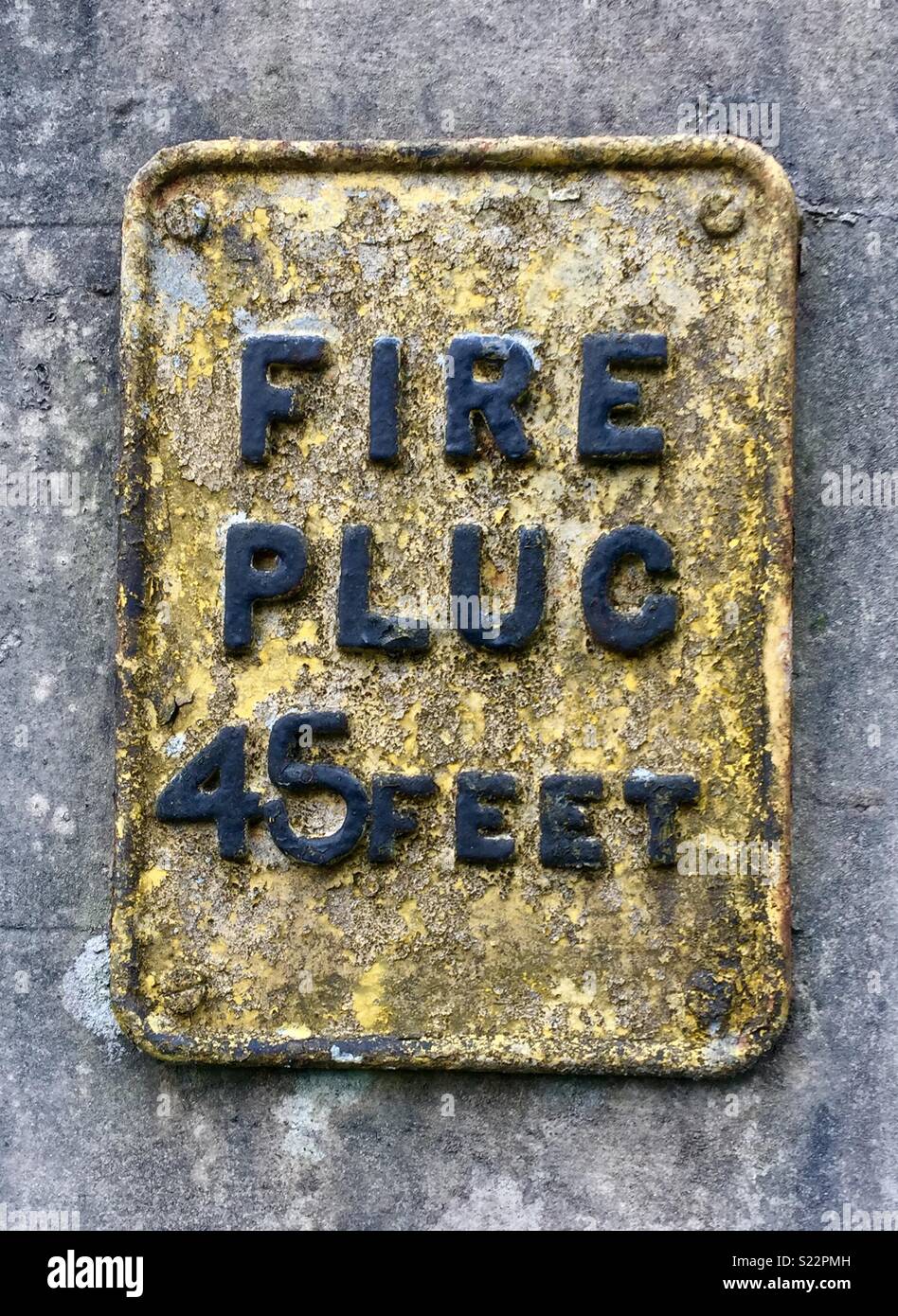 Vintage Fire Plug segno su una parete in Princetown Dartmoor Devon. Foto Stock