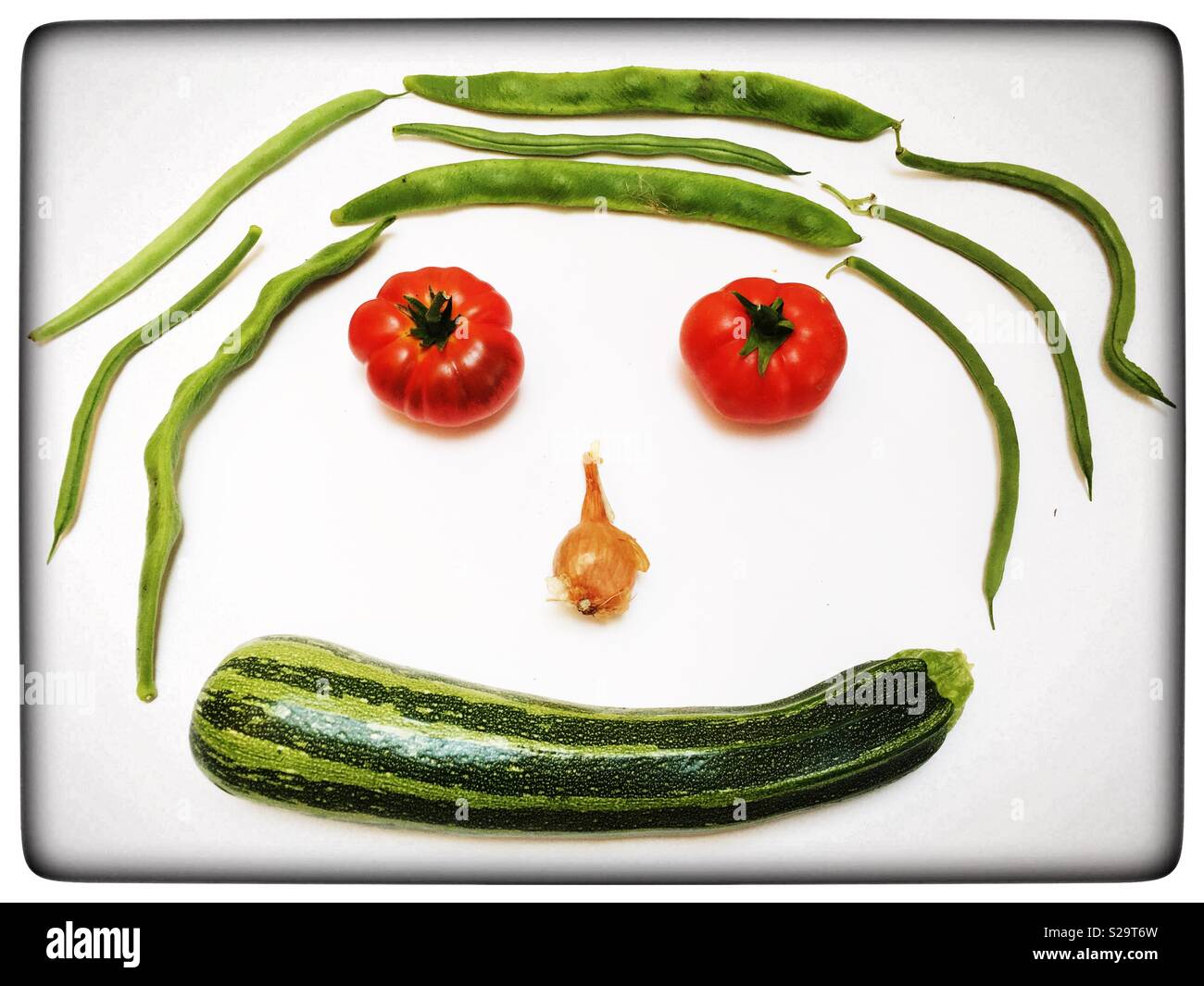 Organicamente le verdure di casa nella forma di una faccia Foto Stock