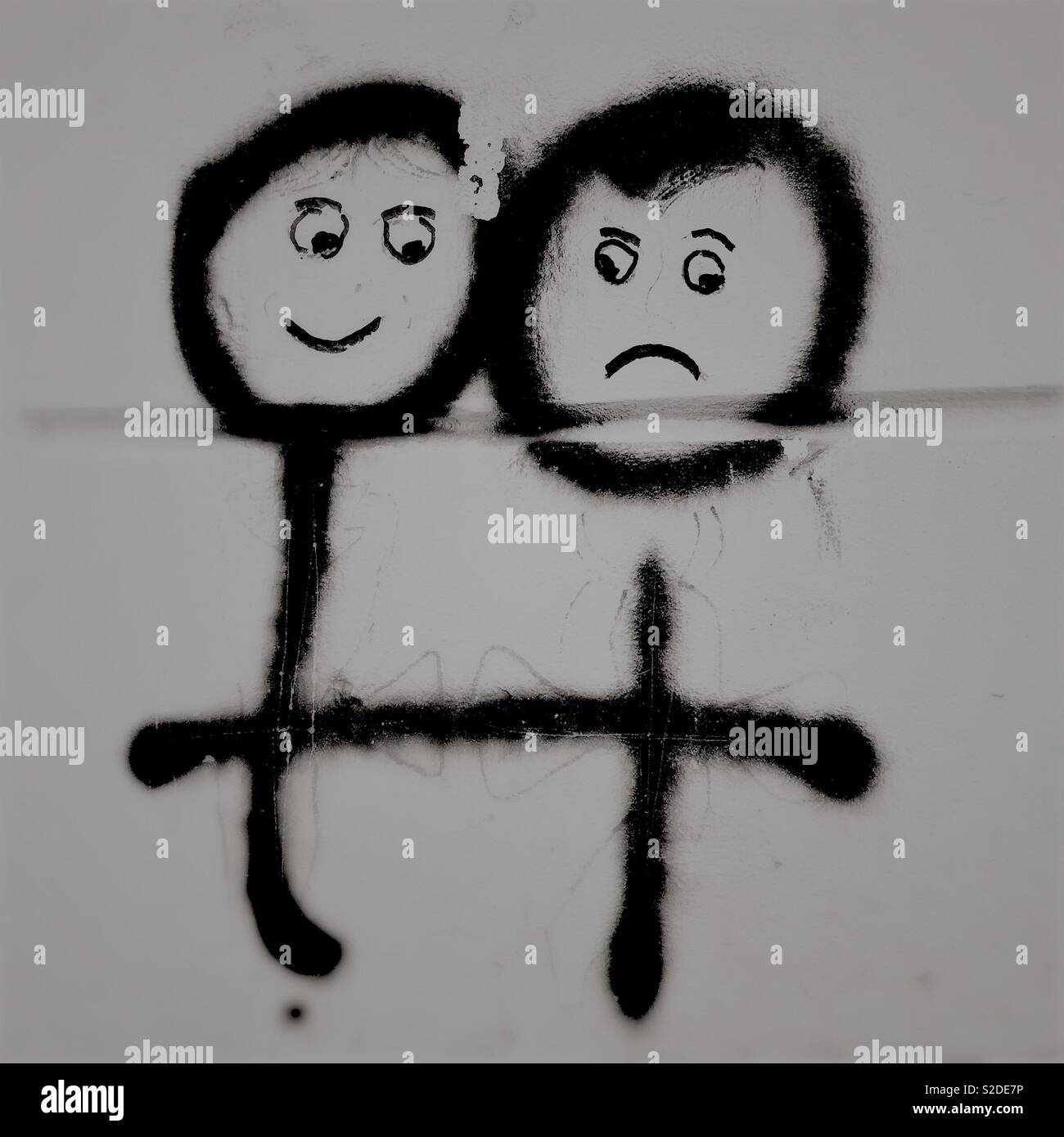 Triste e faccia felice graffiti Foto Stock
