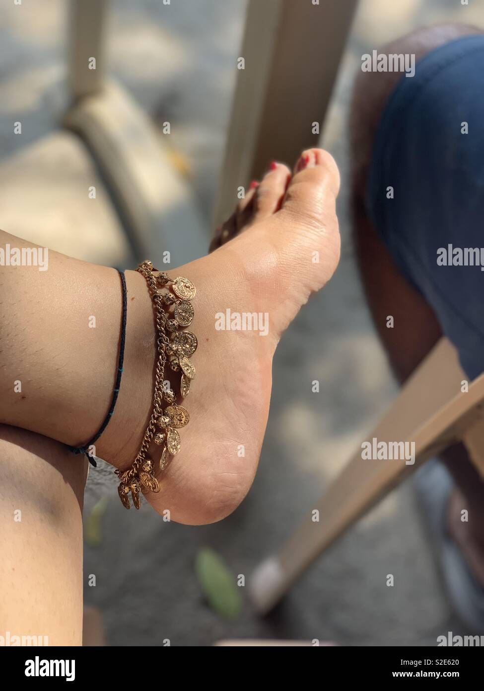 Golden anklet Foto Stock