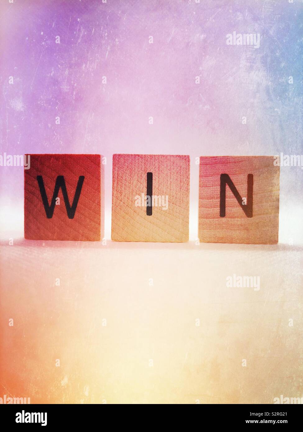 Win, parola motivazionale - Immagine stock catturata con smartphone