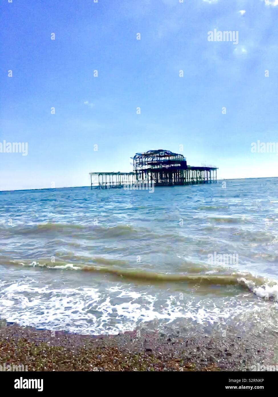 Vecchio bruciate al molo di Brighton Foto Stock