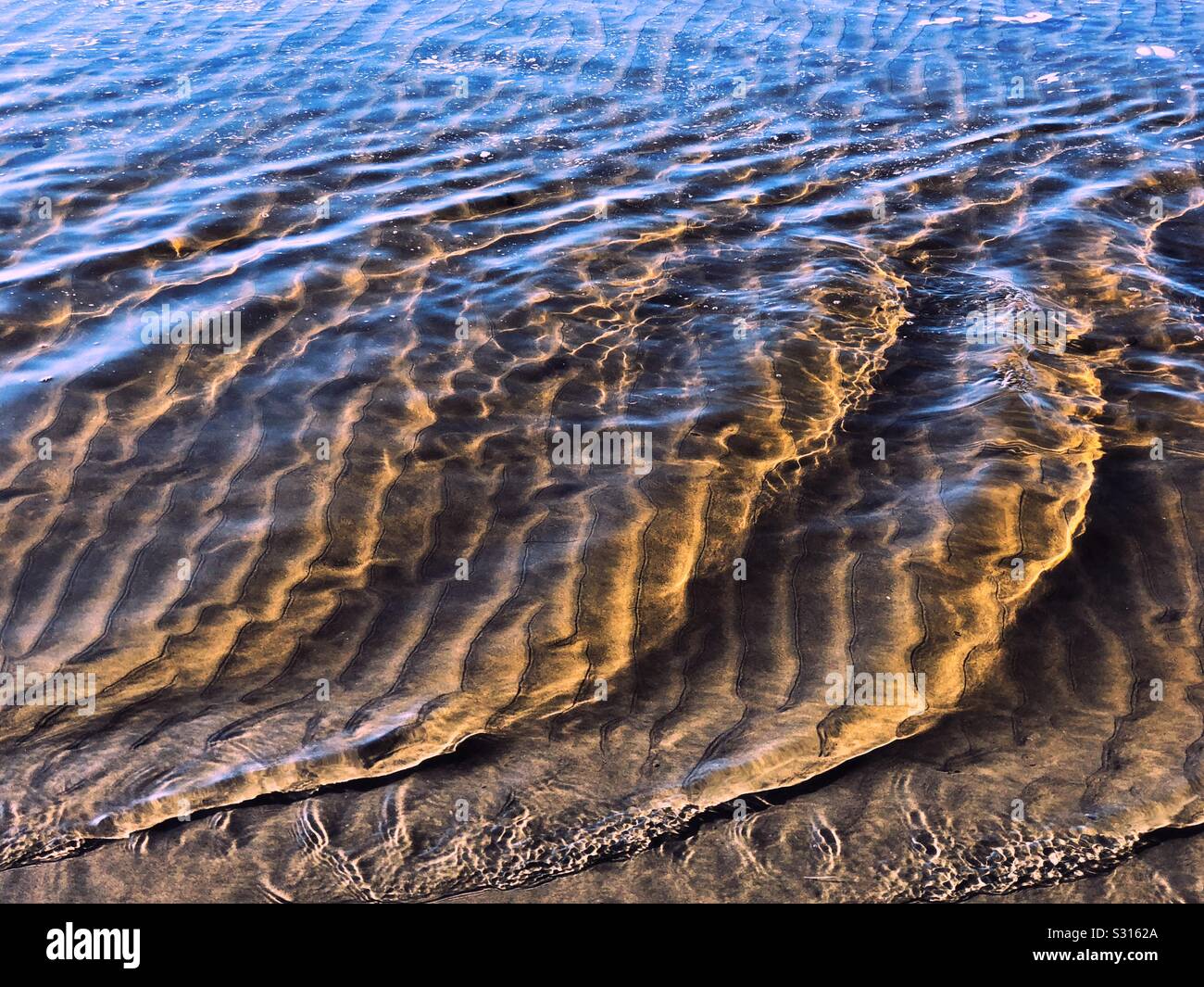 La sabbia, oceano, la luce del sole Foto Stock