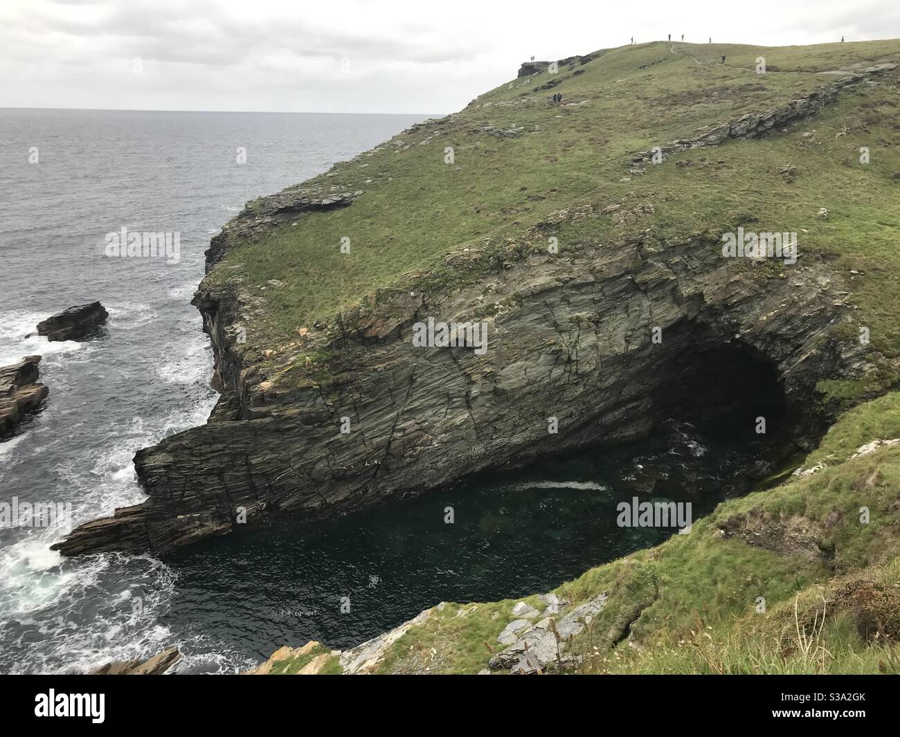 Grotta di Merlin, Tintagel, Cornovaglia Foto Stock