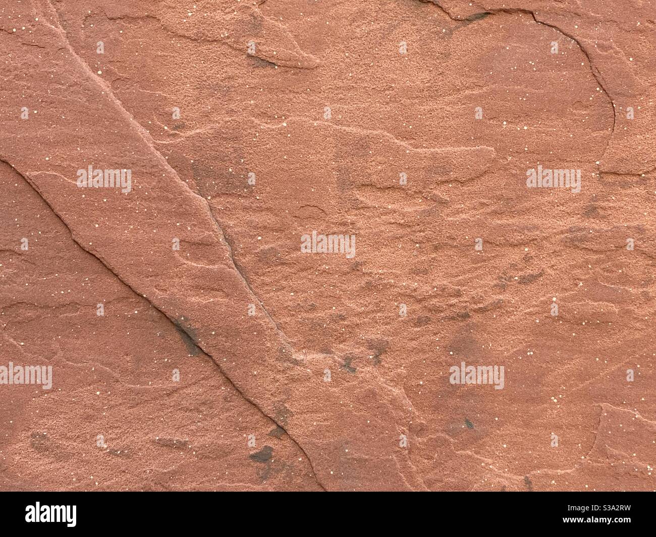Struttura astratta dello sfondo, superficie di roccia marrone-rossastro, adatta per la composizione e la grafica Foto Stock
