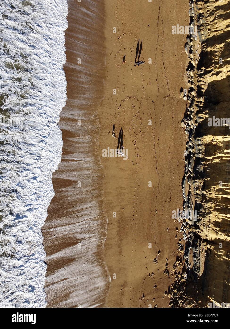 Dog Walkers West Bay Dorset UK Foto Stock