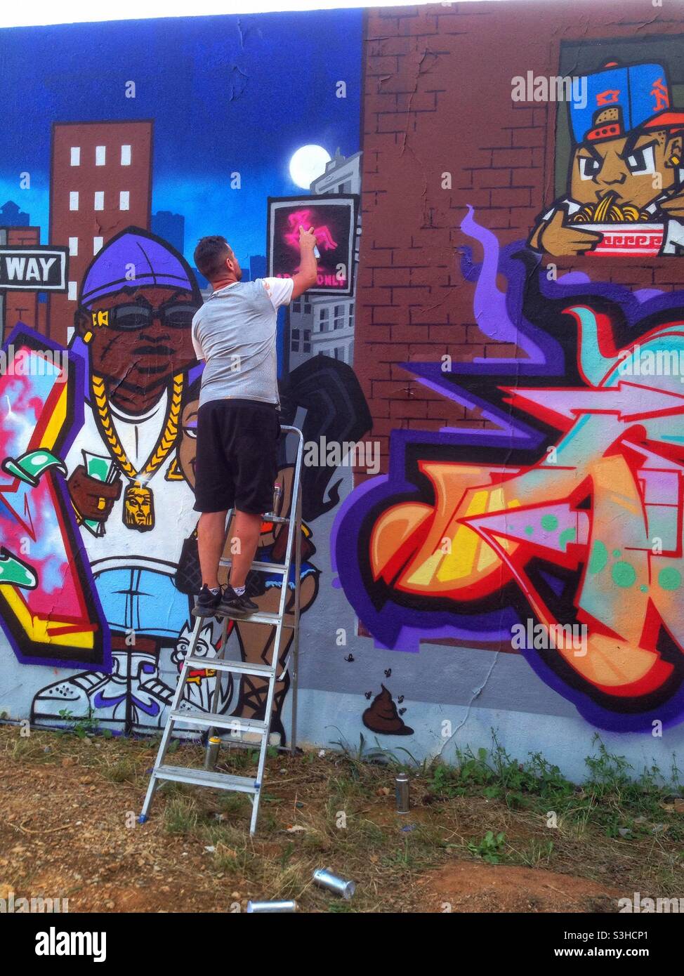 Street Art, artista al lavoro, Montpellier Francia - Immagine stock catturata con smartphone