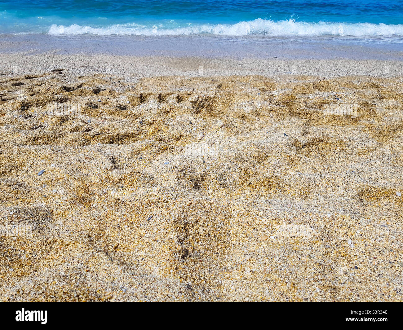 Sabbia di mare sulla spiaggia di Cleopatra ad Alanya, Turchia Foto Stock