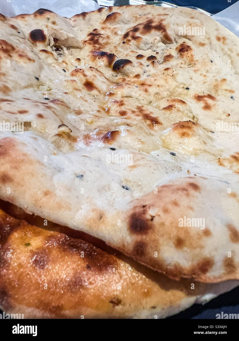 Pane naan all'aglio Foto Stock