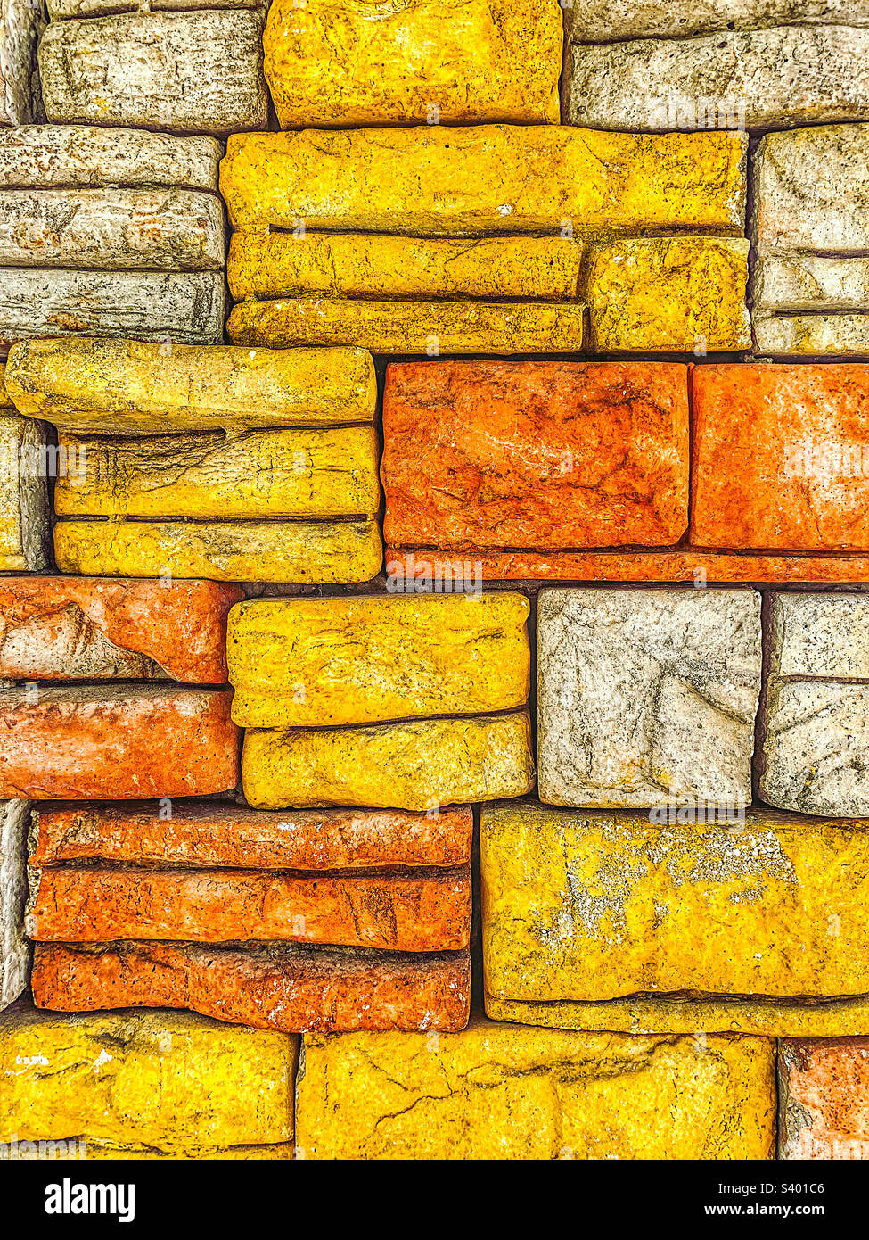 Parete in mattoni di pietra colorata in piena cornice Foto Stock