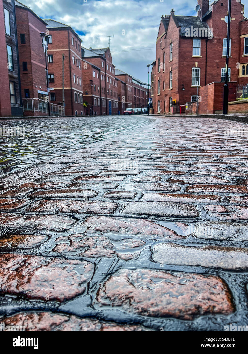 Strada acciottolata nel centro di Leeds Foto Stock