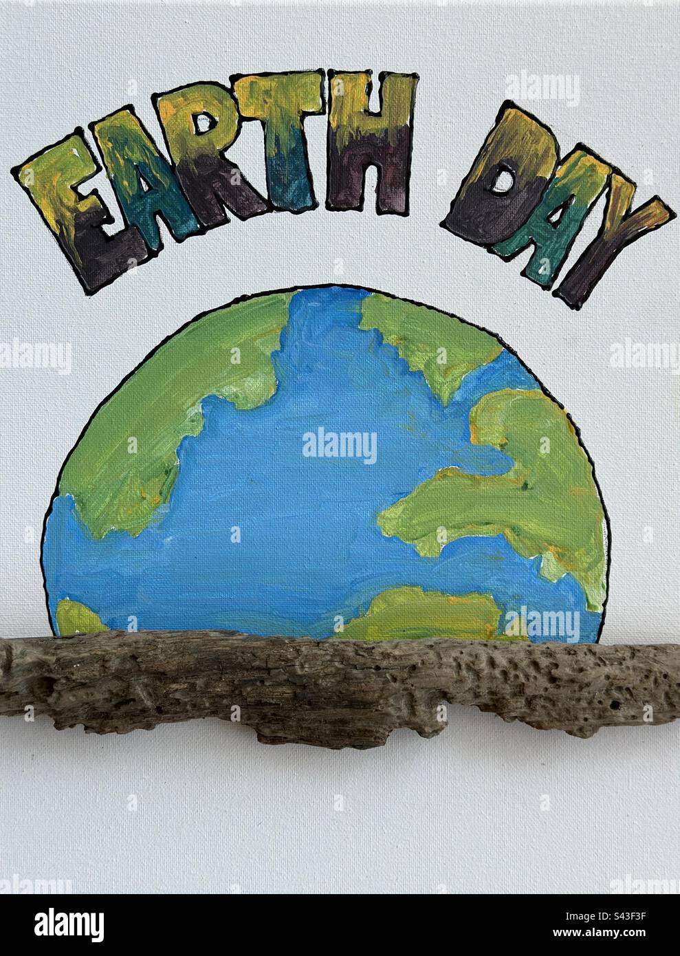 Il mio concetto personale dipinto a mano Earth Day con legno da spiaggia pietrificato Foto Stock