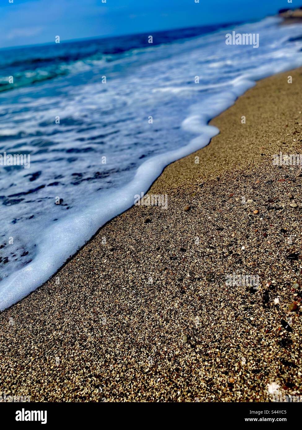 Onde spagnole sulla sabbia di Sea Shore Foto Stock