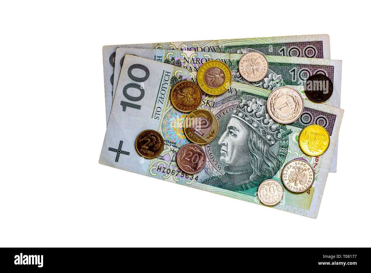 100 zlotys fatture e Polonia groszy monete. Carta polacca di un centinaio di valuta somme isolati su sfondo bianco, vista dall'alto Foto Stock