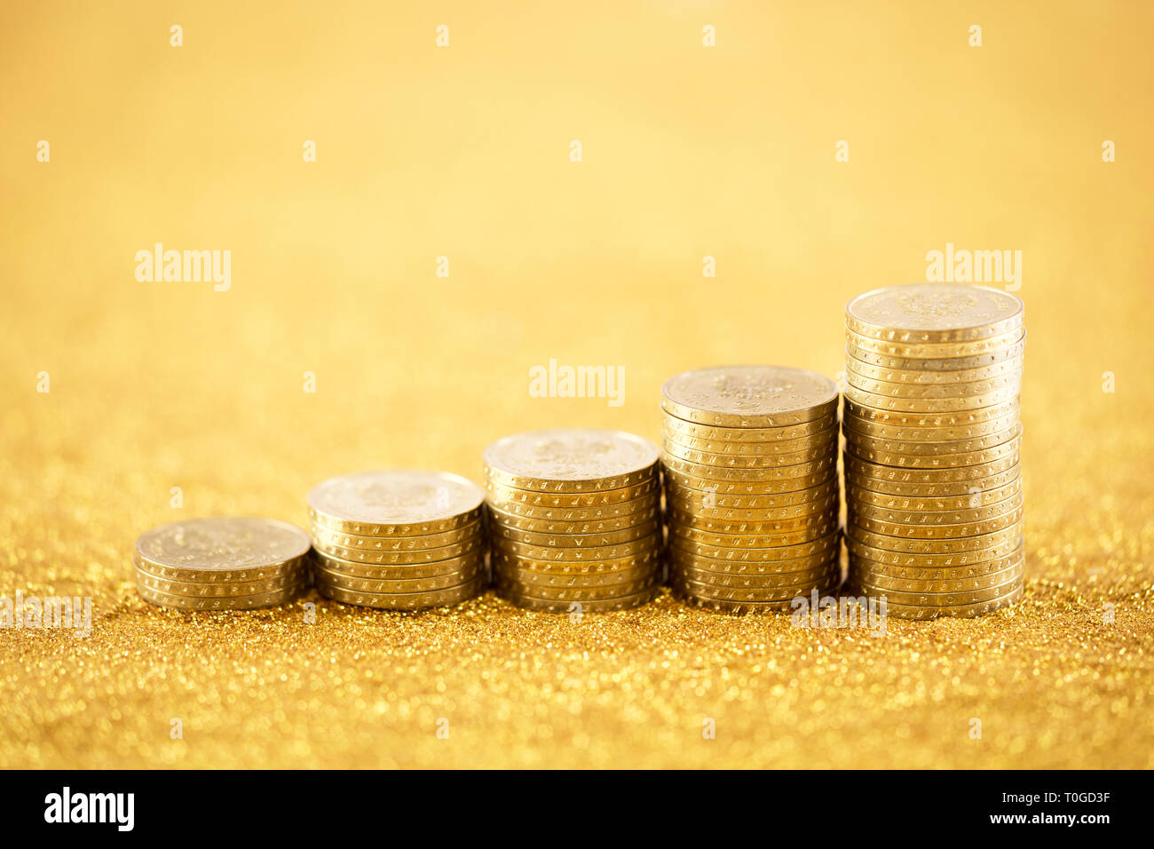 In aumento le monete d'oro Foto Stock