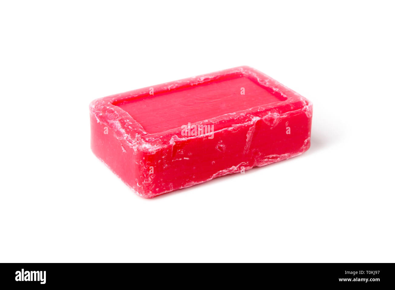 Un pezzo di sapone rosa vicino isolata su bianco Foto Stock