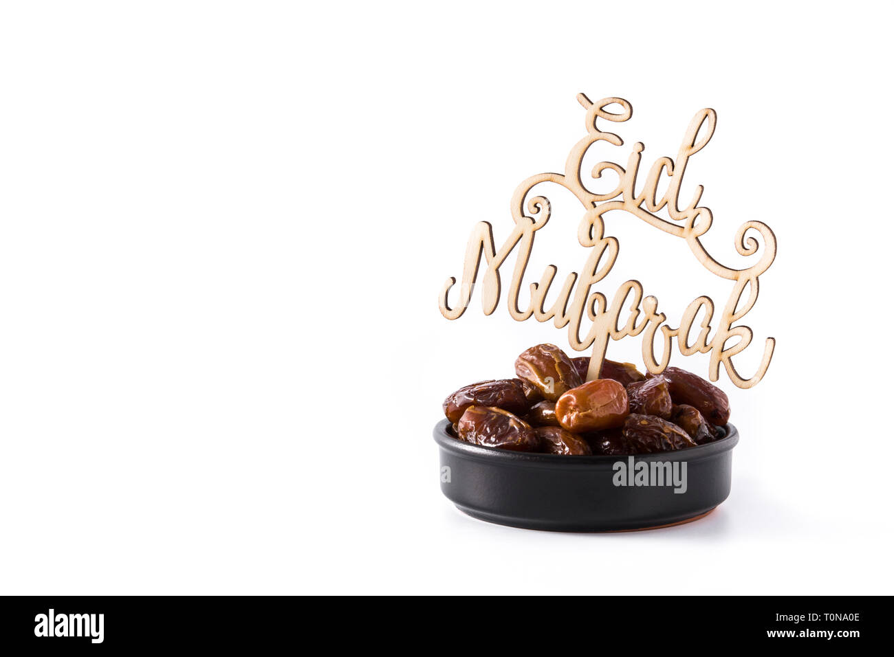Date e Eid Mubarak messaggio isolati su sfondo bianco. Copyspace Foto Stock
