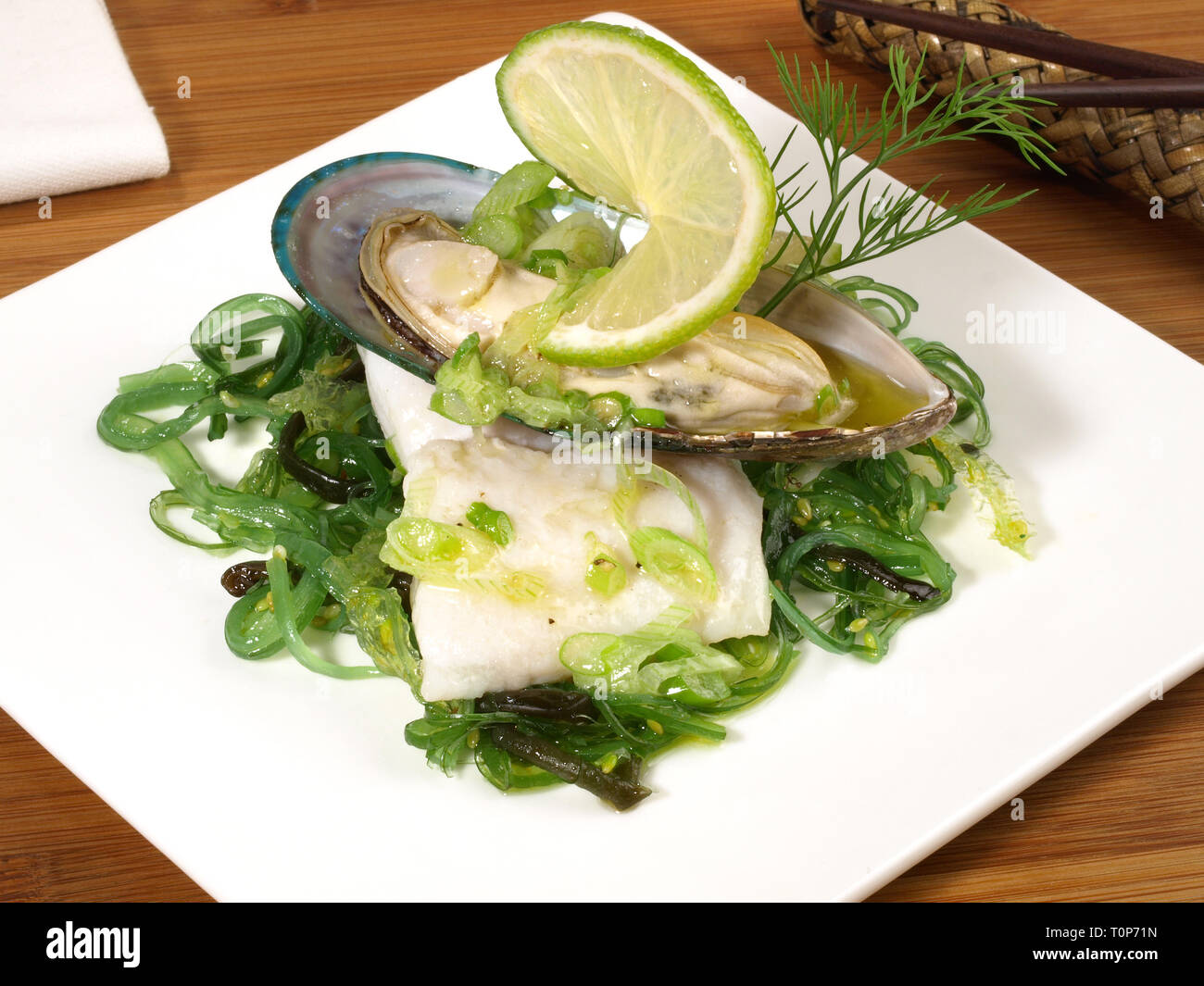 Bollito di filetto di pesce con mitili Greenshell Foto Stock