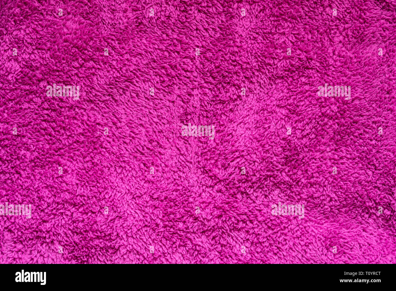 Texture di rosa pelliccia sintetica. Può essere utilizzato come sfondo Foto Stock