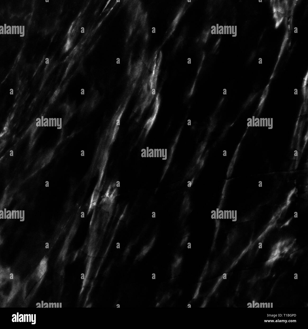 Texture di marmo sul marmo nero la superficie della piastrella, closeup foto sul marmo nero superficie di piastrelle sul pavimento in marmo presentano una texture di marmo in una piastrella, nero b Foto Stock