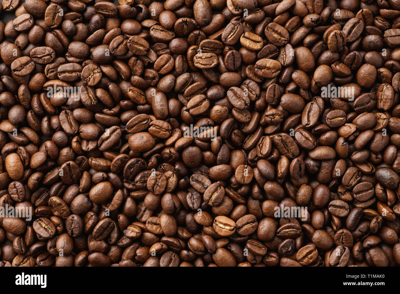 Chicchi di caffè tostati sfondo. Vista dall'alto. Spazio di copia Foto Stock