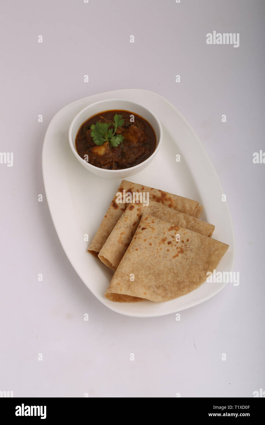 chappati con curry di pollo Foto Stock