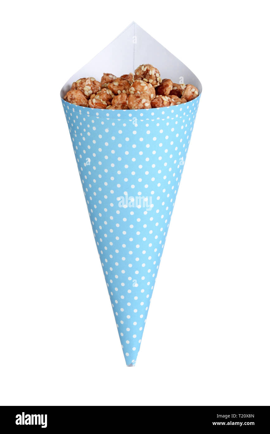 Il miele, semi di sesamo mandorle in un cono Foto Stock