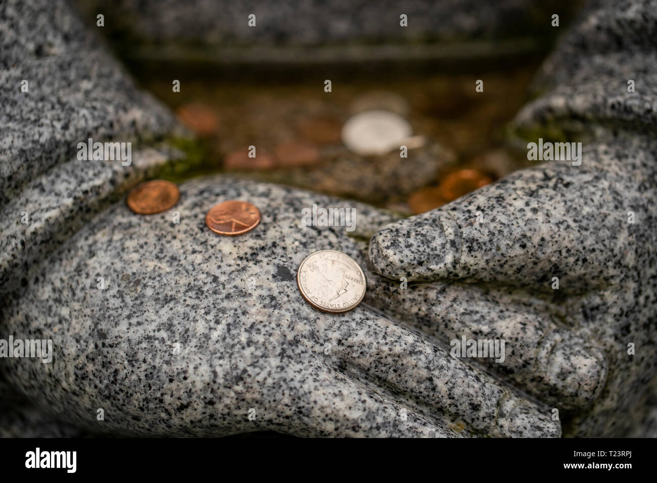 Monete in una fontana Foto Stock