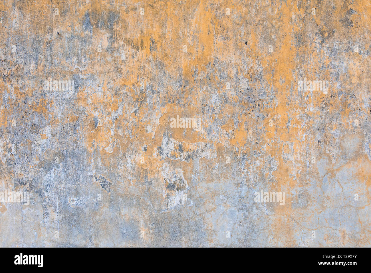 Giallo sbiadito vecchio muro sfondo texture Foto Stock