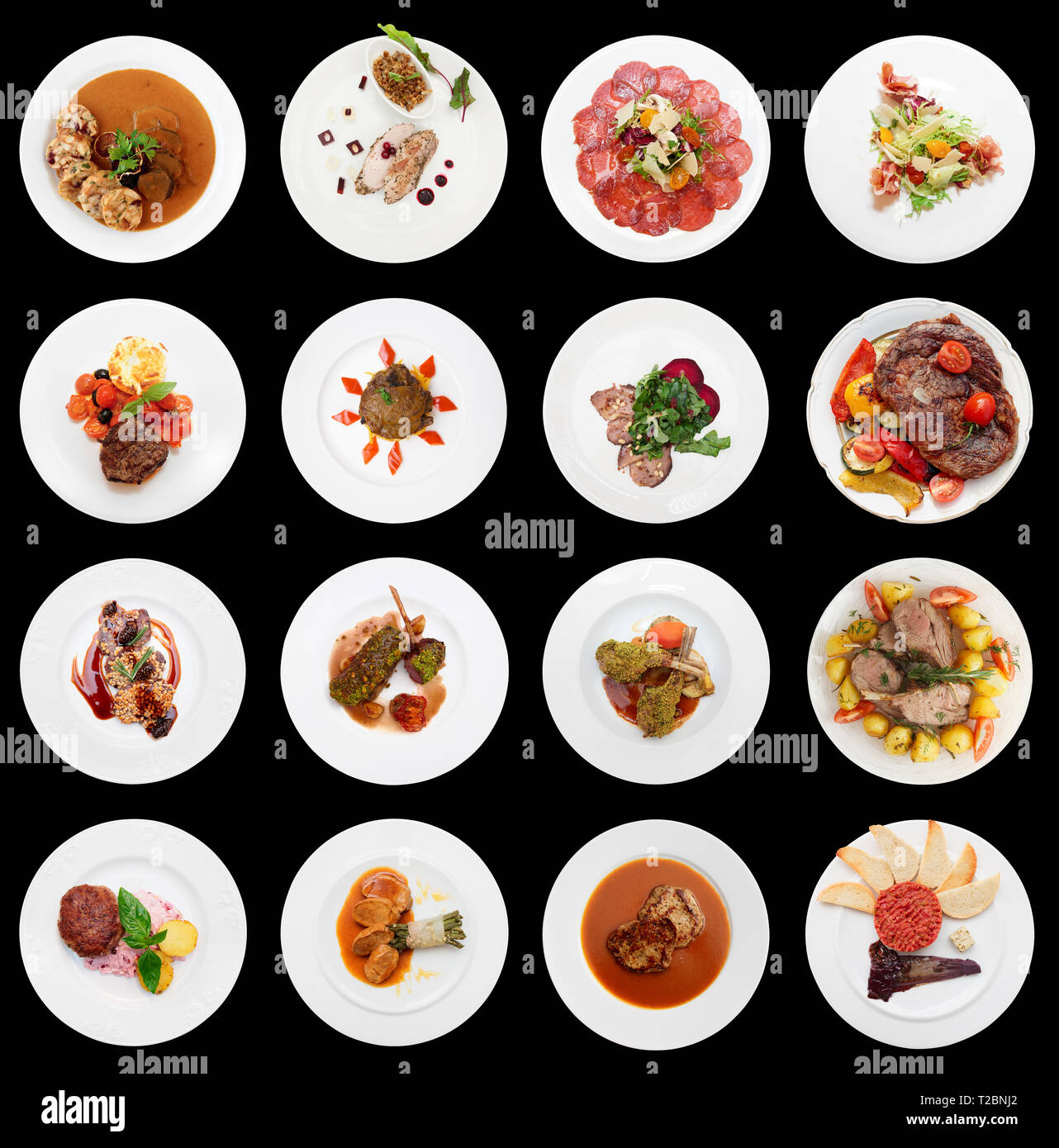 Set di vari piatti a base di carne isolati su sfondo nero Foto Stock