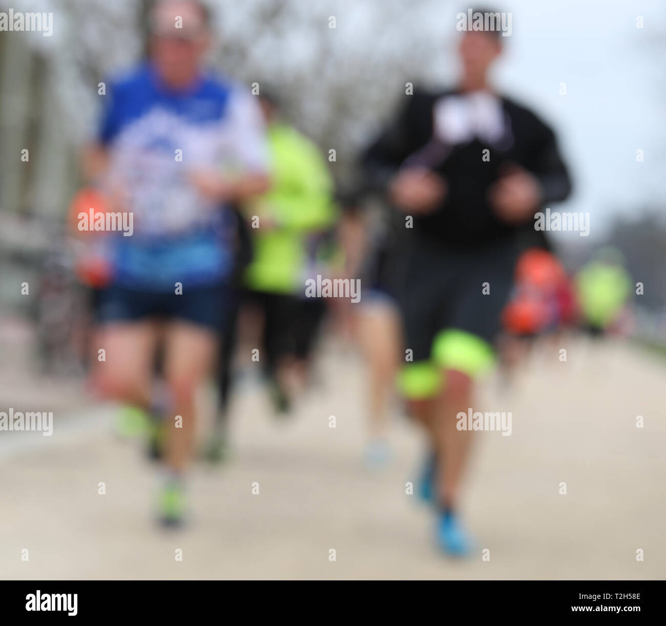 Le persone che eseguono durante la gara intenzionalmente sfocate ideale da utilizzare come sfondo Foto Stock