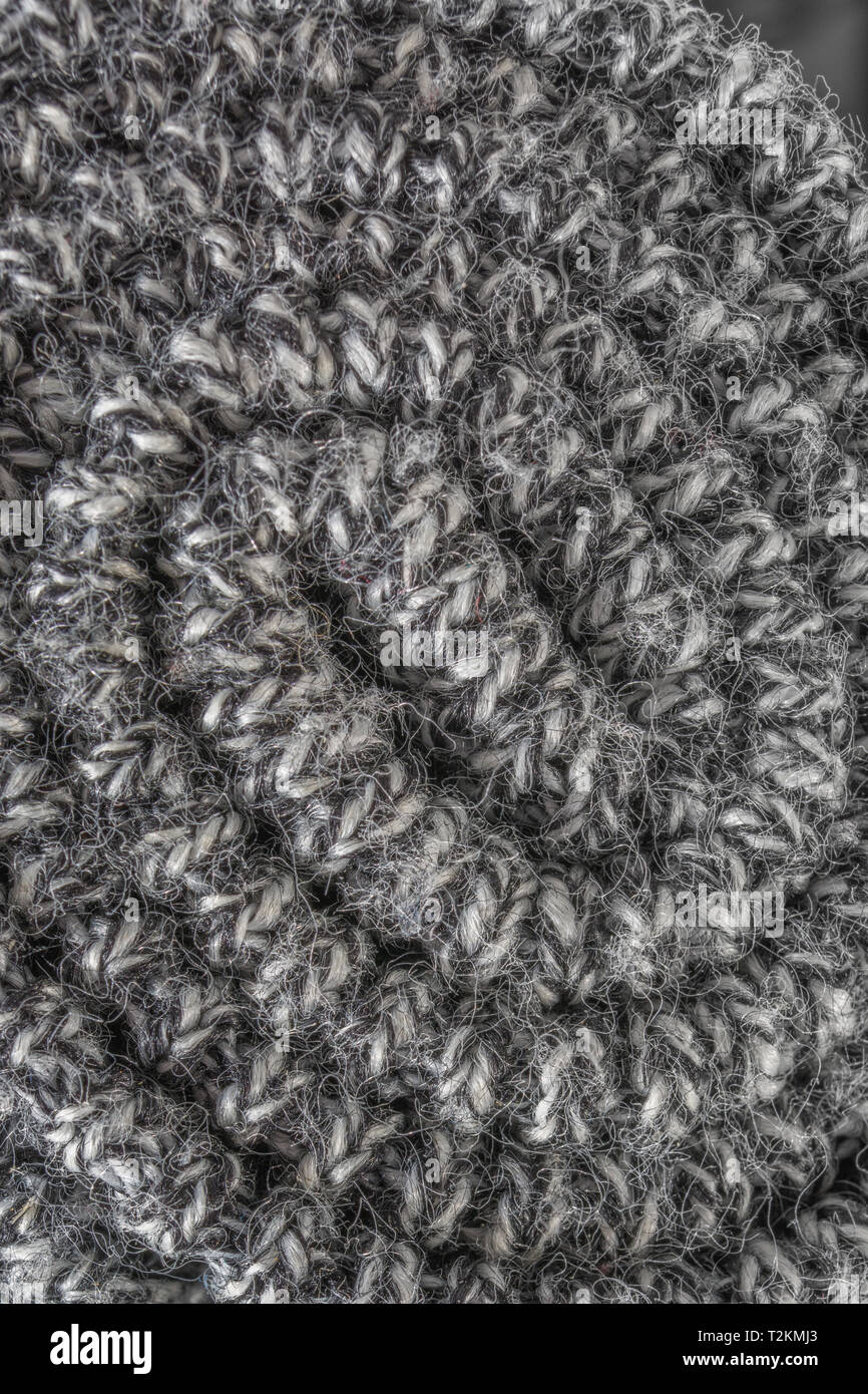 Close-up shot macro interrogati fino tessuto tessuto di poliestere. Metafora cucito in tempo, cucito, trama e ordito, industria tessile, "su un rotolo', tessuti di bordo Foto Stock