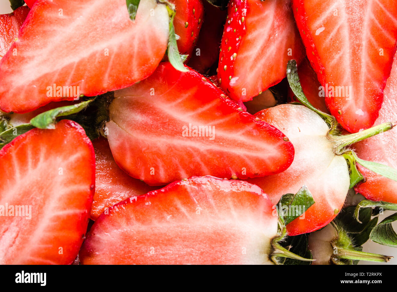 Fresh succosa fragola, texture con pezzi di rosso di fragole Foto Stock