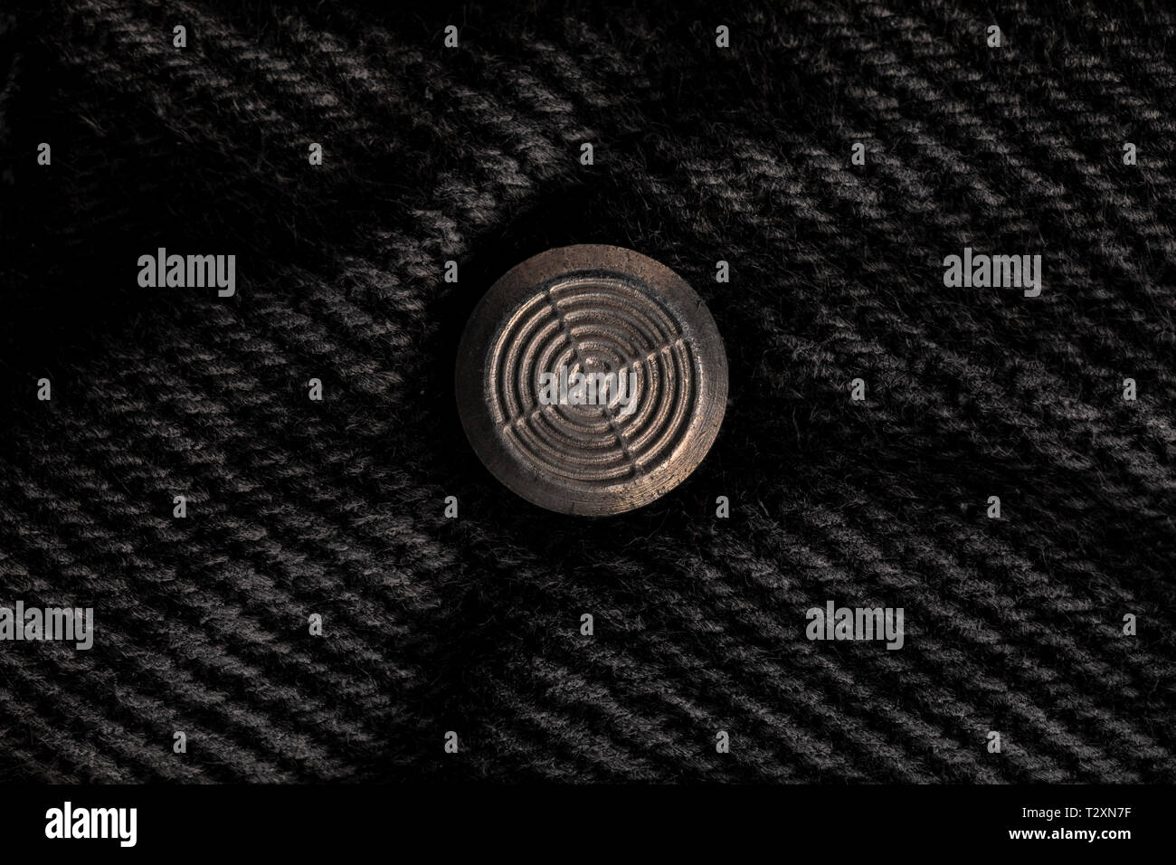 Pulsante sul Jeans nero (la parte interna) Foto Stock