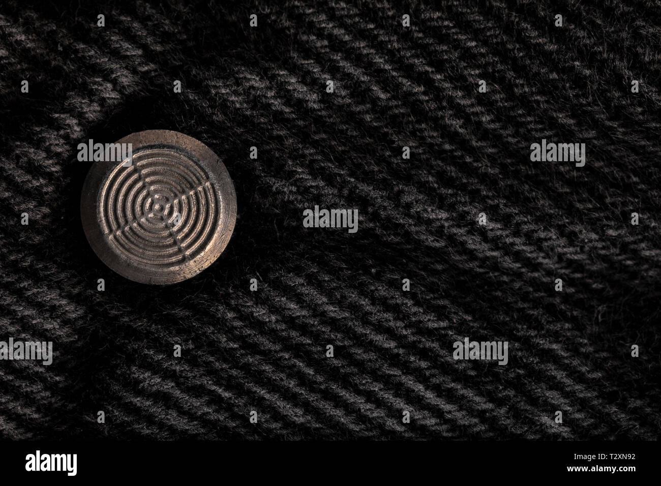 Pulsante sul Jeans nero (la parte interna) Foto Stock