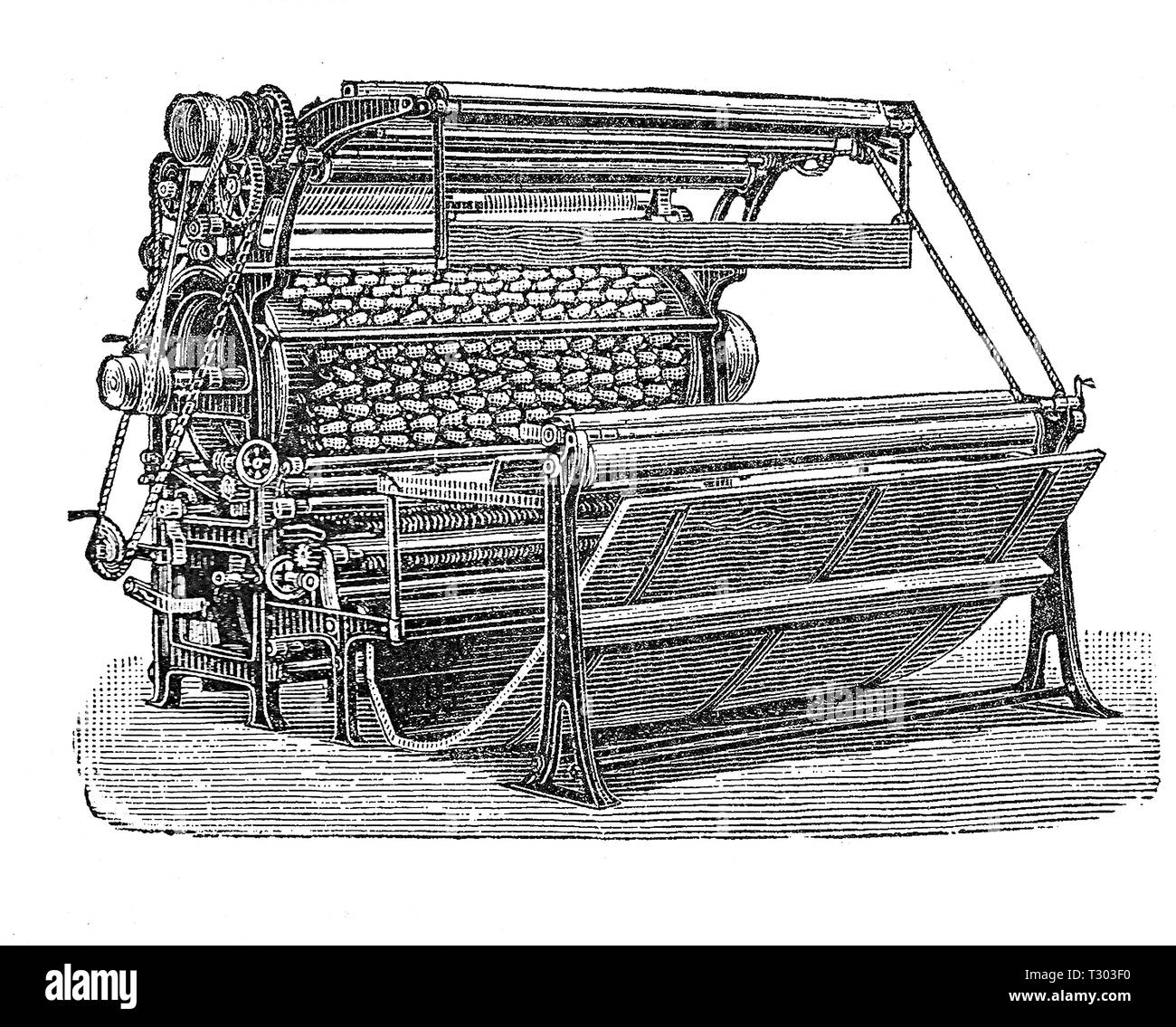 La macchina di cardatura per il finissaggio tessile mechanizes il processo del pan di stoffa produzione: il processo ci stuzzica le estremità delle fibre nel tessuto per produrre un pisolino Foto Stock