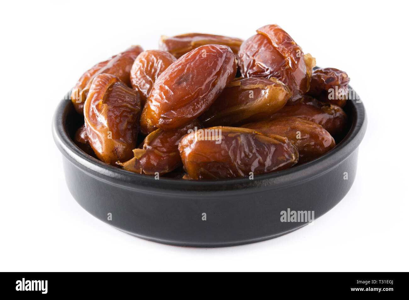 Date in nero ciotola isolato su sfondo bianco. Foto Stock