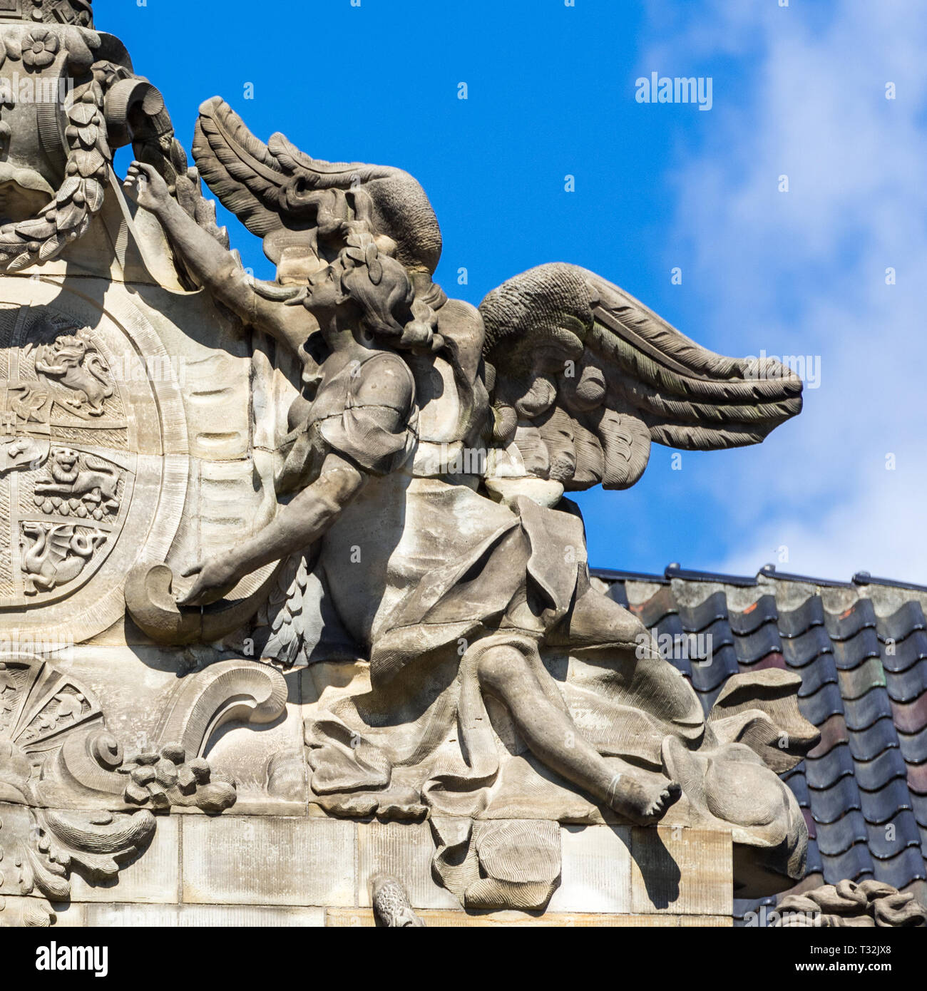 Un angeli guarda al royal crown sulla parte anteriore di Christian VIII il Palazzo di Amalienborg Palace a Copenhagen Foto Stock