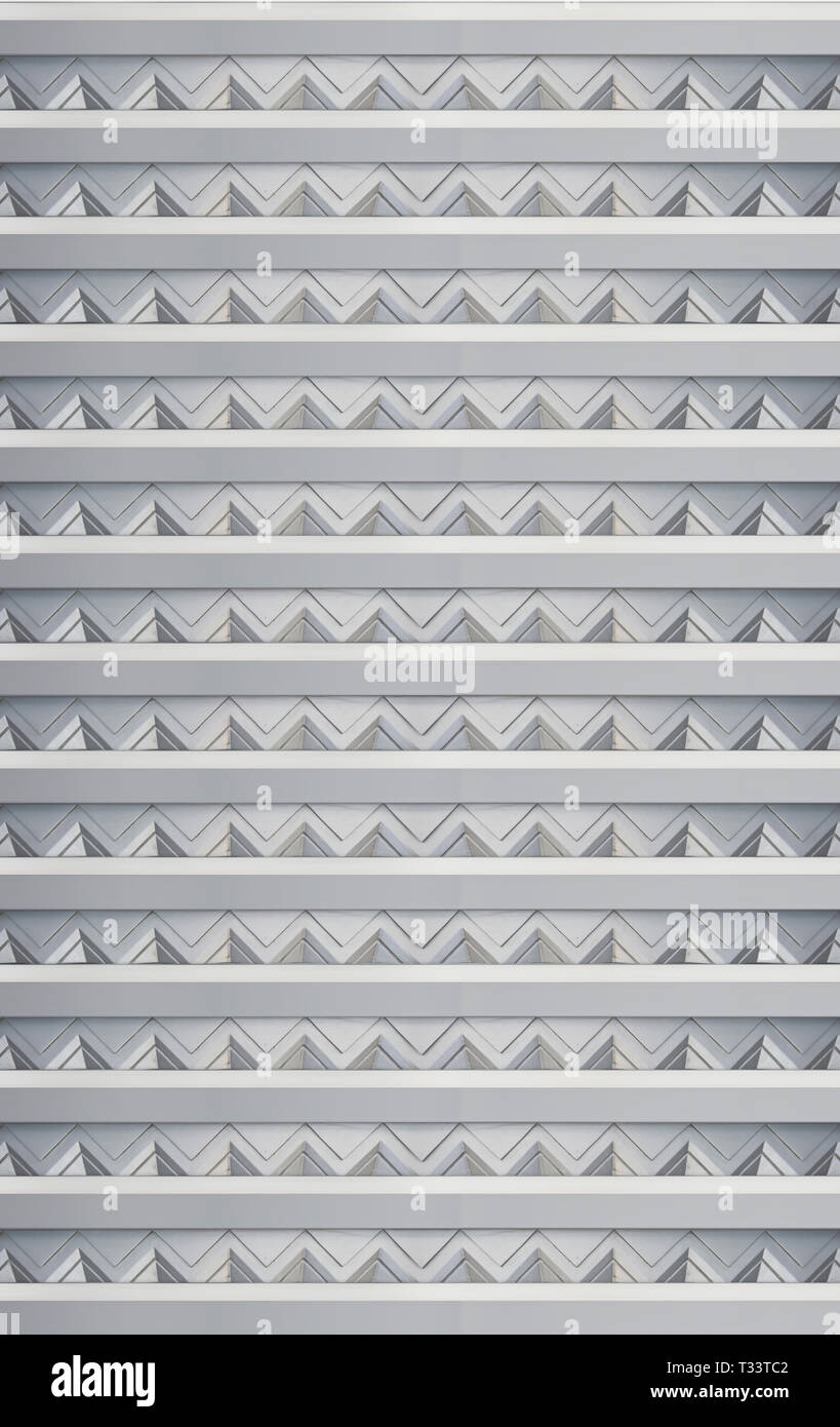 Angolo acuto geometrico rilievo mentale su una città urbana della parete edilizia Foto Stock