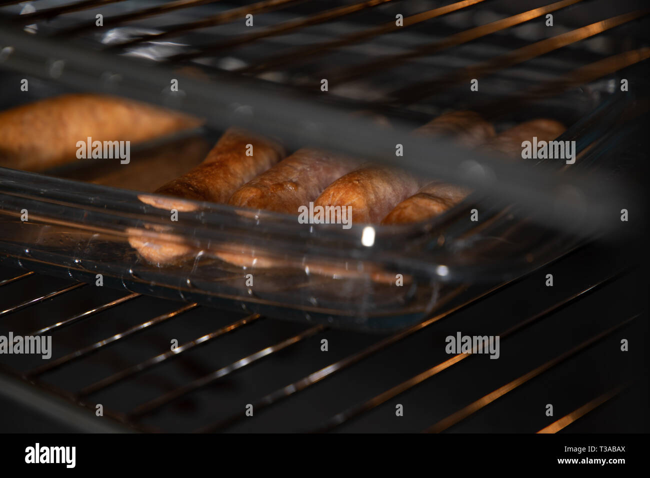 Salsicce al forno Foto Stock