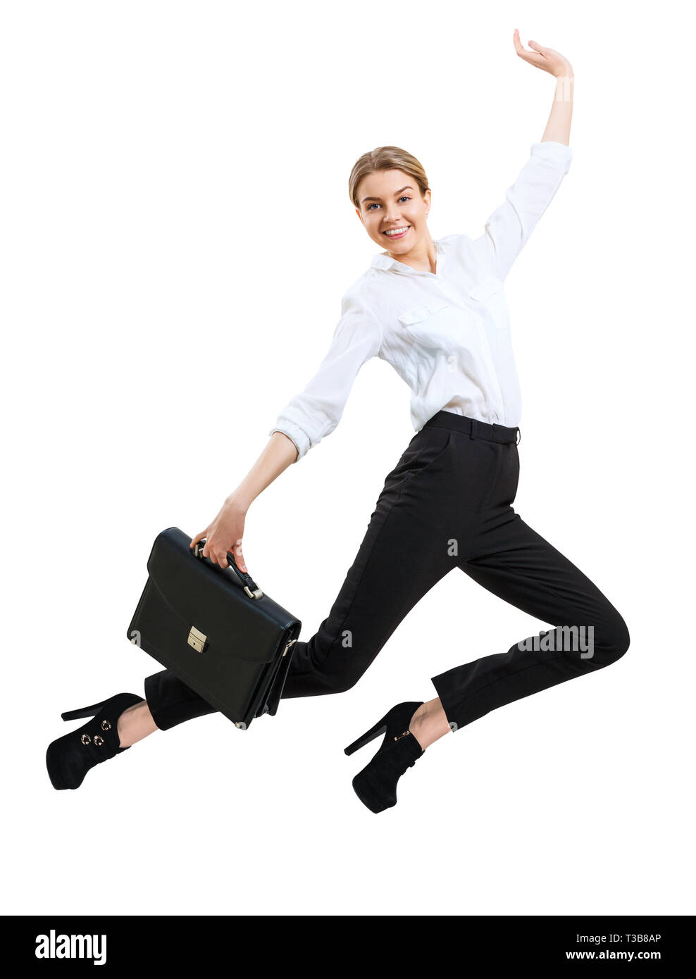 Giovani happy business donna il salto in abbigliamento formale. Foto Stock